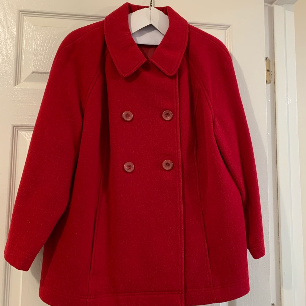 Red wool coat, inverted pleat at back.